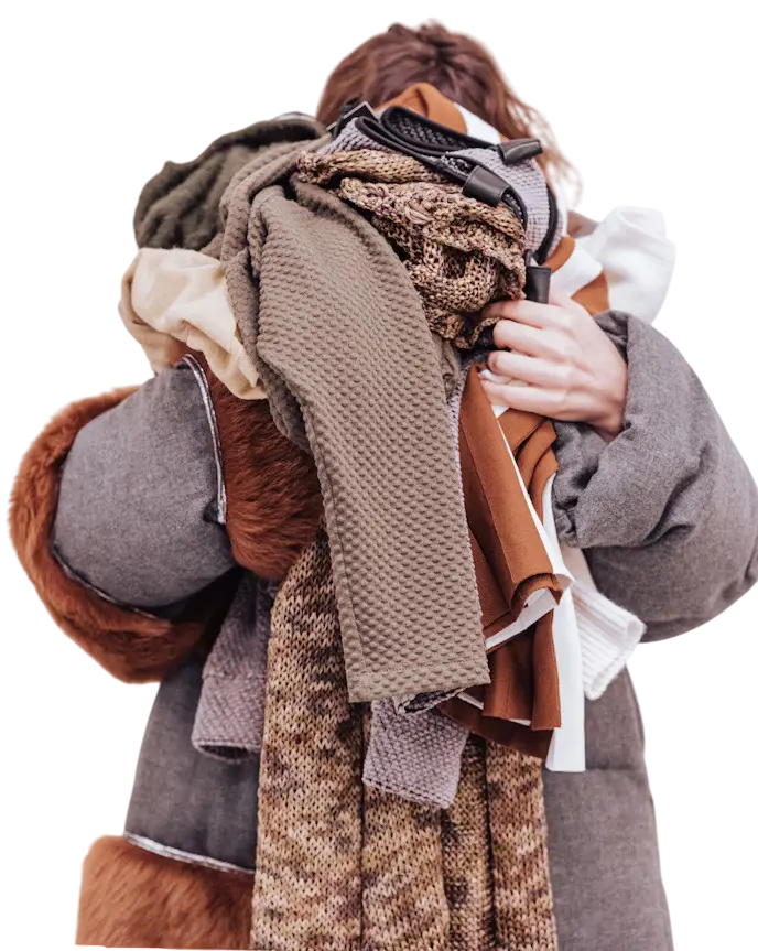 Professional laundry service - woman holding clean clothes